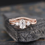 Load image into Gallery viewer, 1.00CT OVAL CUT ROSE GOLD INFINITY THREE STONE BRIDAL MOISSANITE ENGAGEMENT RING SET