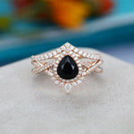 Load image into Gallery viewer, 1.00CT PEAR SHAPED UNIQUE ROSE GOLD CURVED BAND BLACK MOISSANITE ENGAGEMENT RING