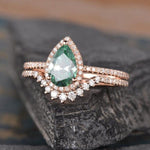 Load image into Gallery viewer, 1.25CT PEAR CUT GREEN HALO DIAMOND MOISSANITE ENGAGEMENT RING BRIDAL SET