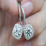 Load image into Gallery viewer, 2.35 TCW ROUND CUT MOISSANITE HALO STYLE HOOP EARRING