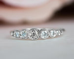 Load image into Gallery viewer, DELICATE BEZEL SET MOISSANITE DIAMOND WHITE GOLD ENGAGEMENT WEDDING STACKING RING
