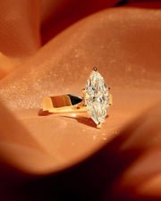 Stunning 2.50ct marquise cut lab grown diamond engagement ring featuring a unique flair shank design. This eye-catching bridal ring is perfect for weddings, anniversaries, or romantic gifts. A sustainable and stylish diamond ring that beautifully celebrates love for her or your special girl.