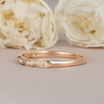 Load image into Gallery viewer, ROUND CUT ROSE GOLD HALF ETERNITY DAINTY TWIST STACKING MINIMALIST MOISSANITE WEDDING BAND
