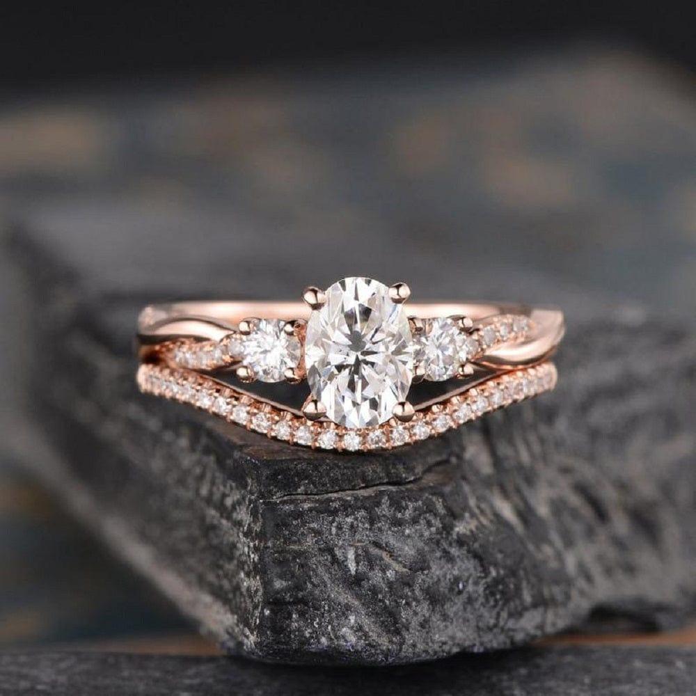 1.00CT OVAL CUT ROSE GOLD INFINITY THREE STONE BRIDAL MOISSANITE ENGAGEMENT RING SET