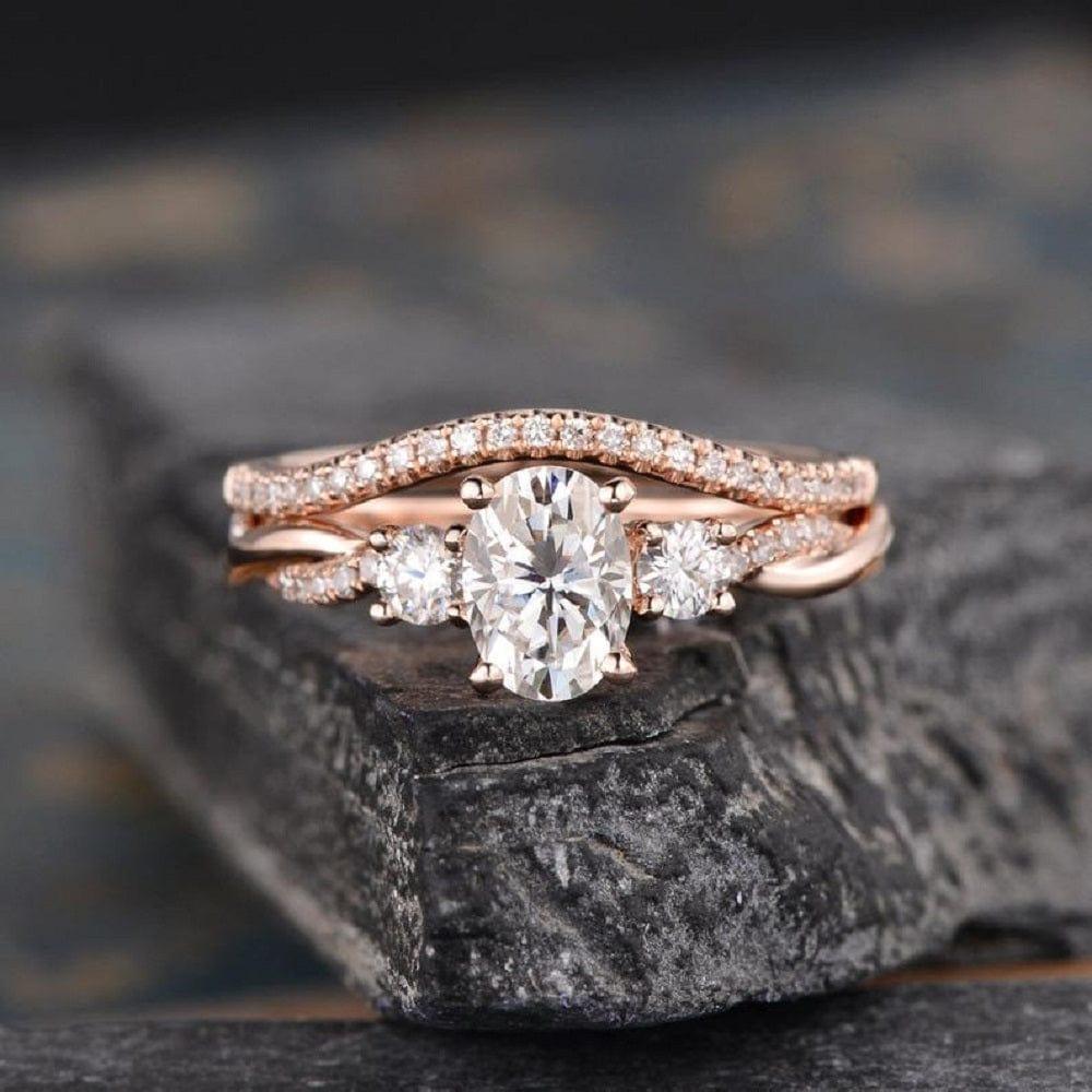 1.00CT OVAL CUT ROSE GOLD INFINITY THREE STONE BRIDAL MOISSANITE ENGAGEMENT RING SET