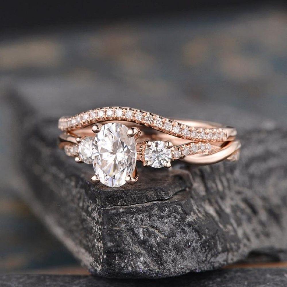 1.00CT OVAL CUT ROSE GOLD INFINITY THREE STONE BRIDAL MOISSANITE ENGAGEMENT RING SET