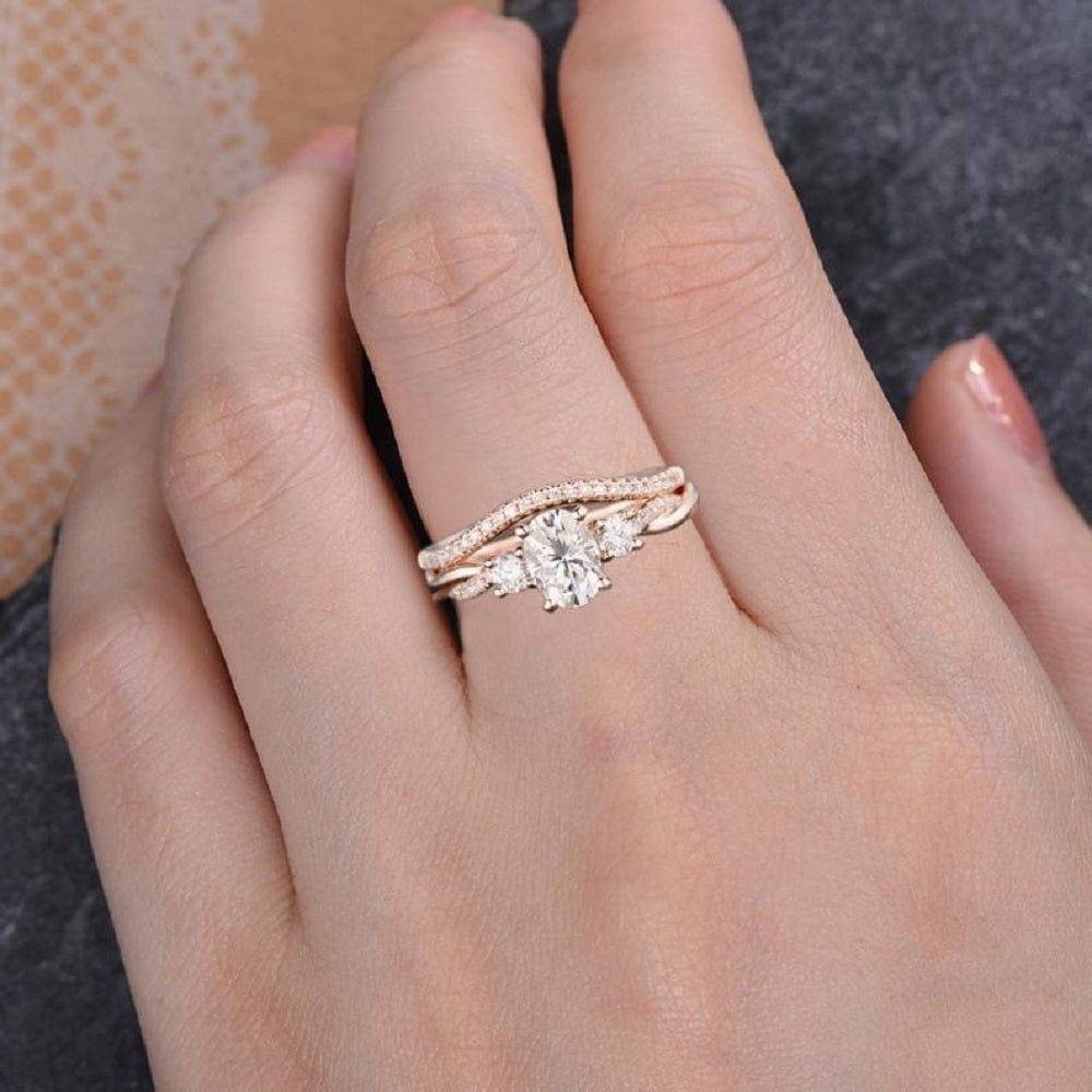 1.00CT OVAL CUT ROSE GOLD INFINITY THREE STONE BRIDAL MOISSANITE ENGAGEMENT RING SET