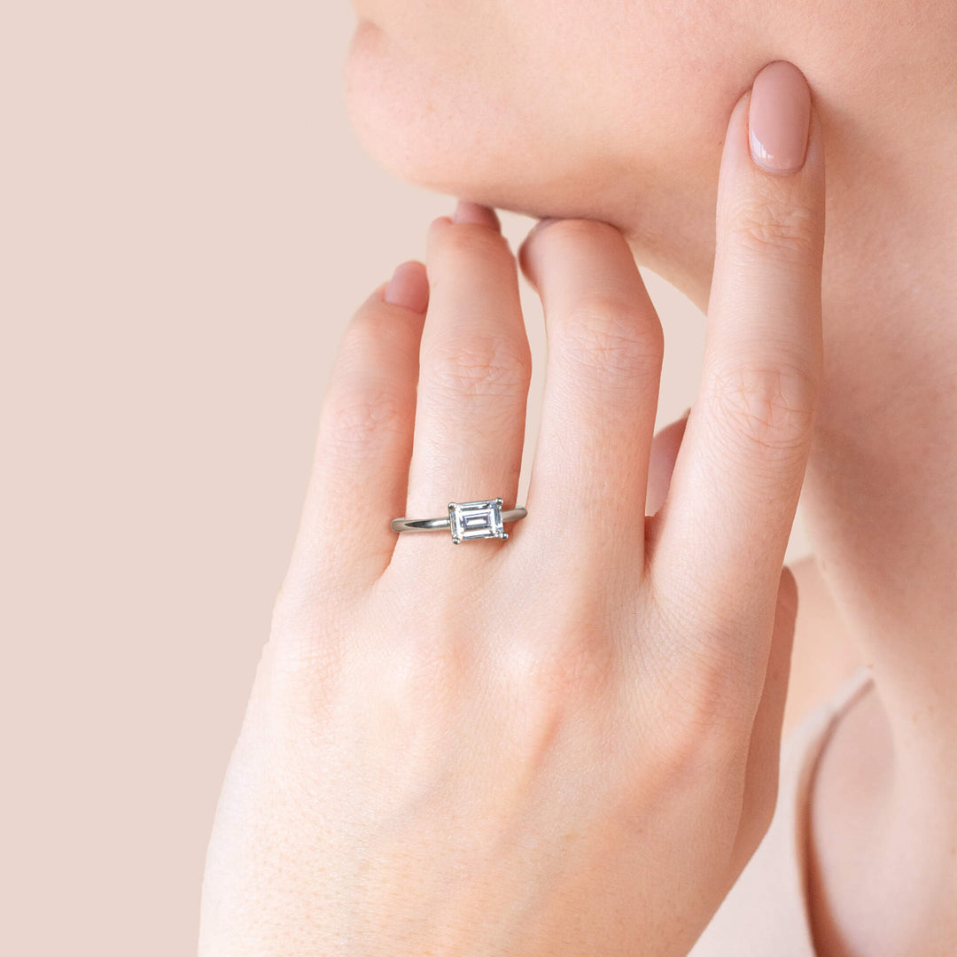 EDGY BASKET CLASSIC EMERALD CUT MOISSANITE ENGAGEMENT RING