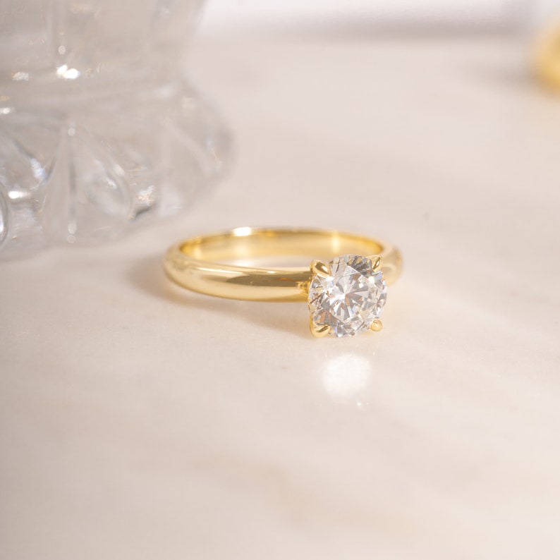 gold solitaire anniversary ring