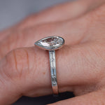 Load image into Gallery viewer, Side view of the ring showing the channel set baguettes