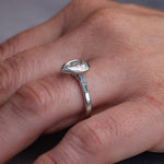 Load image into Gallery viewer, Three quarter view of the ring showing the channel set accent baguettes