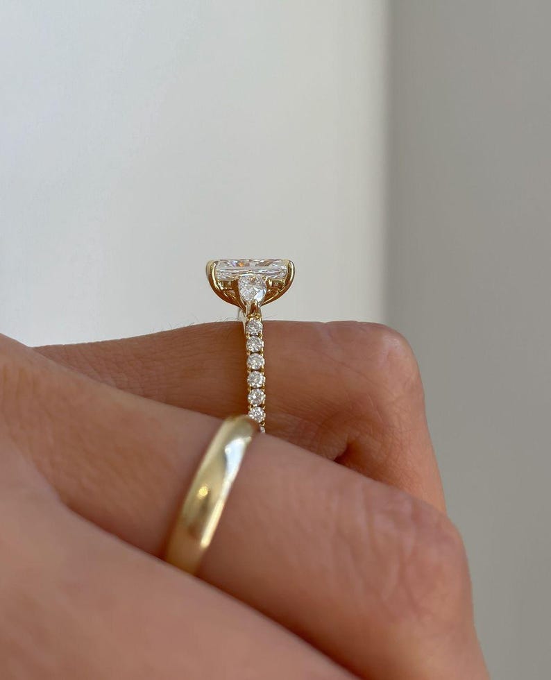 Top view of radiant cut 3.0tcw lab created diamond engagement ring with a cathedral setting and hidden halo that adds brilliance from every angle. This wedding ring is a beautiful expression of love, ideal for modern brides who want elegance, sparkle, and sustainability in one piece.