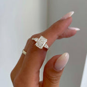 Radiant 3.0tcw lab grown diamond engagement ring featuring a cathedral setting, pave diamond accents, and a hidden halo for added brilliance. This ethically crafted ring is a perfect wedding or anniversary gift for her, combining sustainable sparkle with timeless bridal elegance.