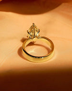 Load image into Gallery viewer, Elegant and bold, this 2.50ct marquise lab grown diamond ring showcases a unique flair shank that sets it apart as a one-of-a-kind engagement or wedding ring. Ideal for bridal occasions, anniversaries, or a meaningful gift for your girl — ethically made and endlessly radiant.