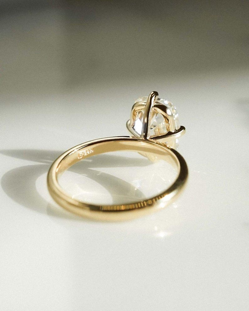 3ct lab grown cushion solitaire diamond ring with a cathedral prong setting and polished straight shank. A stunning engagement ring or unique bridal ring for her—also perfect for special occasions like birthdays or anniversaries with meaningful style.