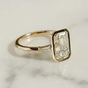 Lab grown 2.5ct emerald diamond ring featuring side tapered accents. A beautiful engagement or bridal ring for the woman you love.