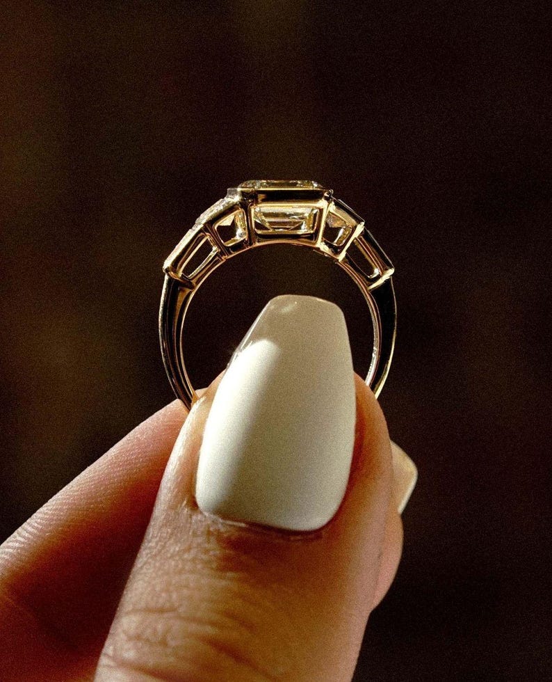 Asscher 3.0tcw lab grown diamond full bezel engagement ring accented with side stones. IGI certified for trusted origins, this wedding ring doubles as a timeless forever ring, celebrating a modern love story with clean lines and ethical craftsmanship.