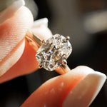 Load image into Gallery viewer, This 3ct cushion cut lab grown diamond solitaire ring features a cathedral setting with prong mount and a sleek straight shank. A timeless engagement ring, ideal as a unique bridal piece, birthday gift, or promise ring for her—crafted with ethical brilliance.