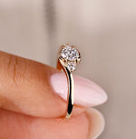 Load image into Gallery viewer, Yellow gold engagement ring featuring a round cut diamond for a classic look.
