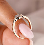 Load image into Gallery viewer, 3 stone diamond ring with a round cut diamond in the center for added sparkle.