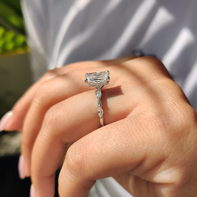 Prong setting ring secures a radiant cut center.