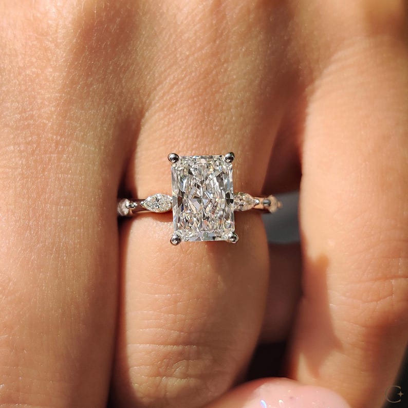 Marquise side stone ring adds shape and structure.