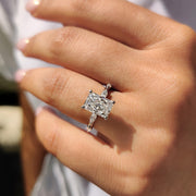 Radiant engagement ring features a hidden halo setting.