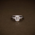 Load image into Gallery viewer, 1.95 CTW Emerald Cut Lab Grown Diamond Engagement Ring | IGI Certified Ring with Marquise &amp; Round Side Diamonds image 1