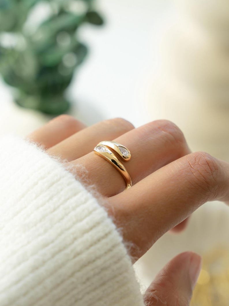 Gold open adjustable ring with pear cut cubic zirconia stones