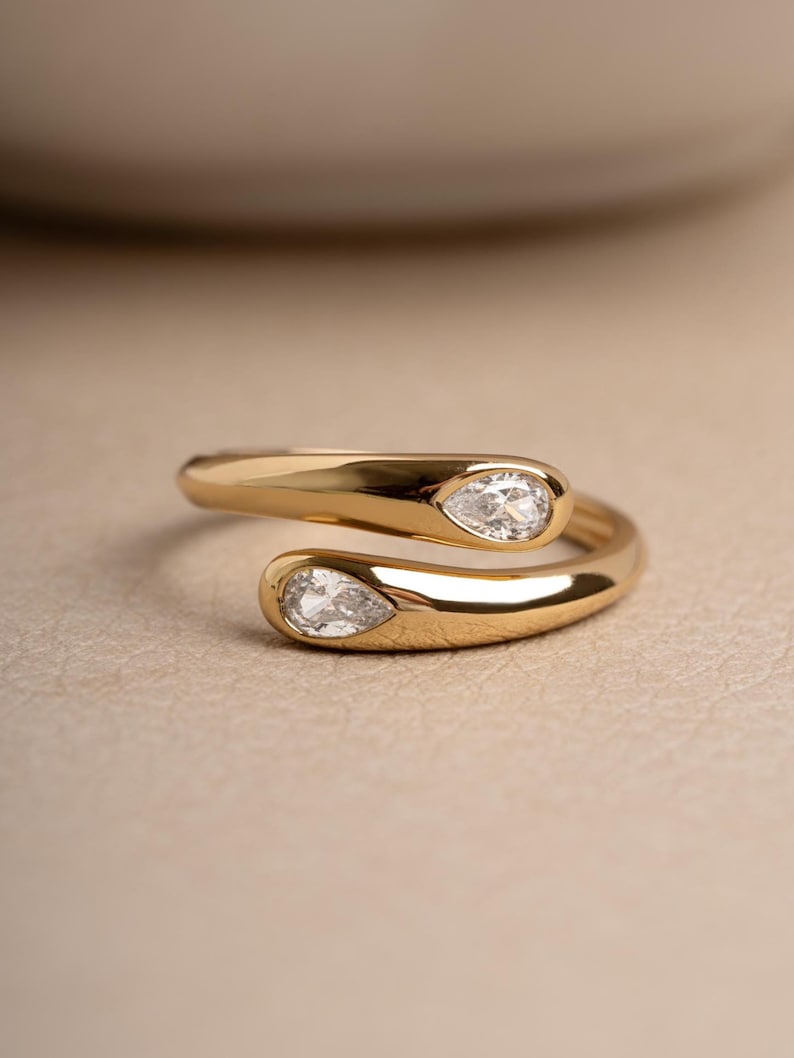 Gold dainty adjustable ring on beige background