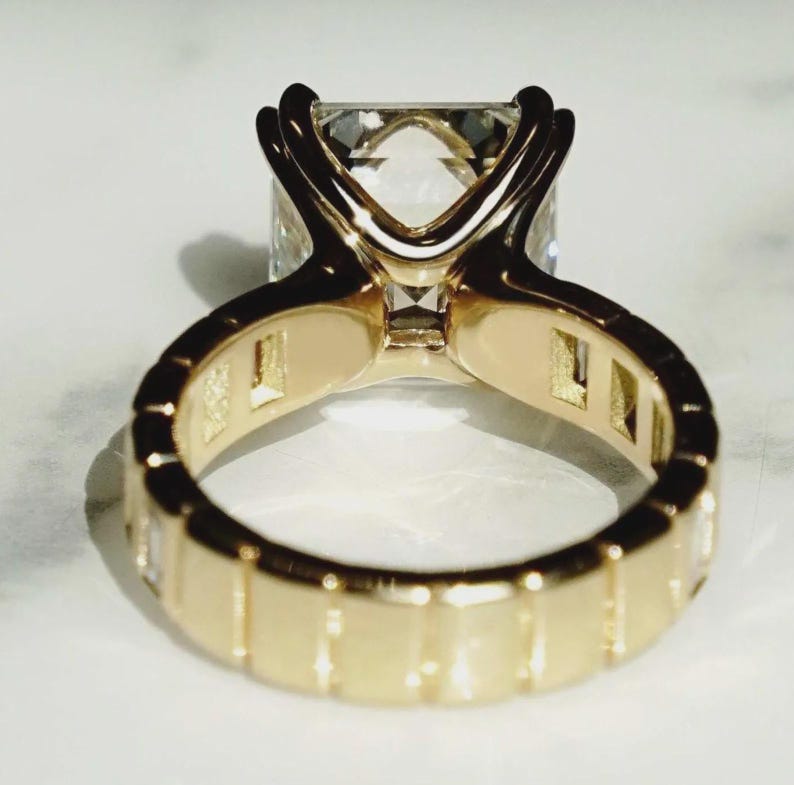 baguette side stone engagement ring