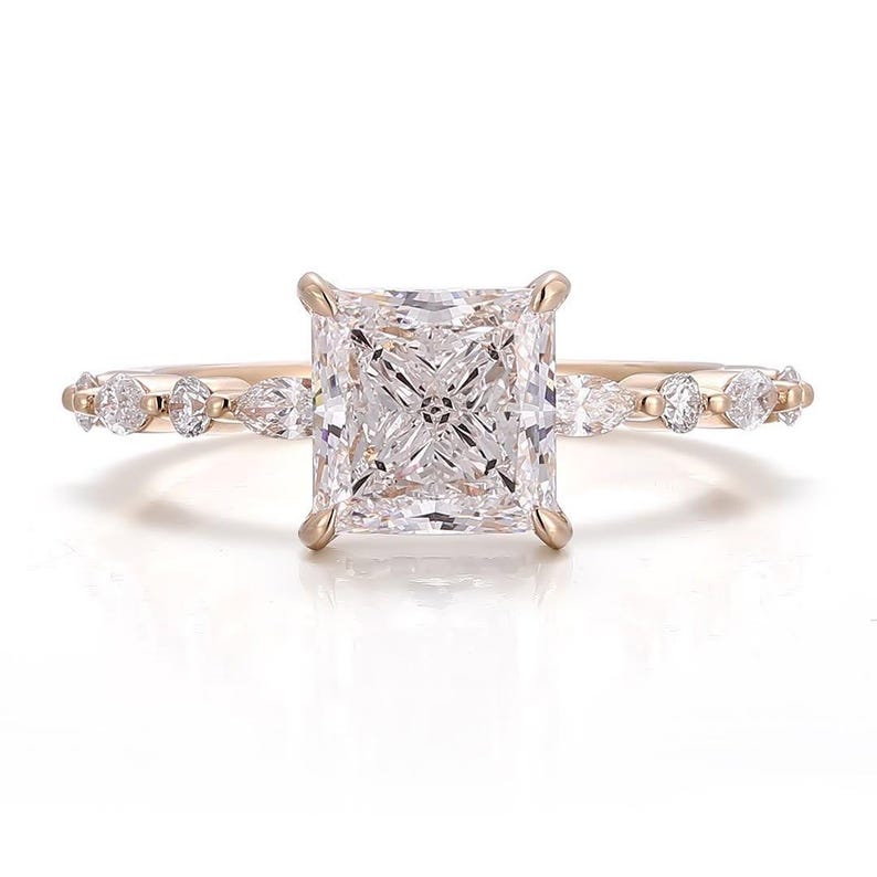 princess cut ring
princess cut engagement ring
gold engagement ring
delicate engagement ring
dainty ring
diamond accent ring
side stone ring
bridal ring
wedding ring
proposal ring
engagement ring for her
unique engagement ring
alternative engagement ring
moissanite ring
princess cut moissanite
princess cut solitaire
solitaire with side stones
gold dainty ring
dainty gold jewelry
14k gold ring
rose gold ring
yellow gold ring
luxury engagement ring
sparkly ring
fine jewelry
minimalist ring