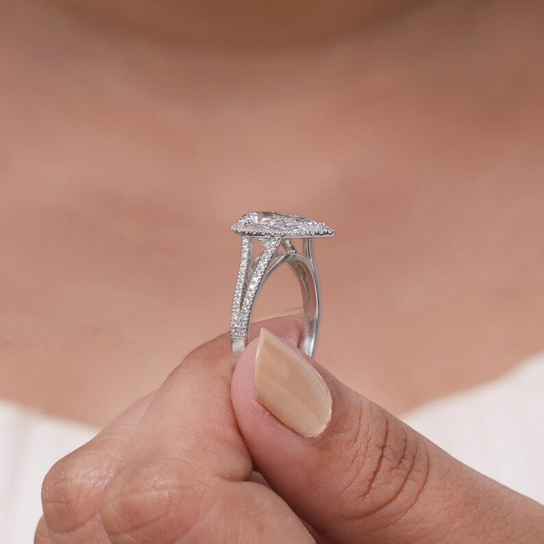 Lab grown pear shaped diamond halo engagement ring with split shank band in 18k white gold