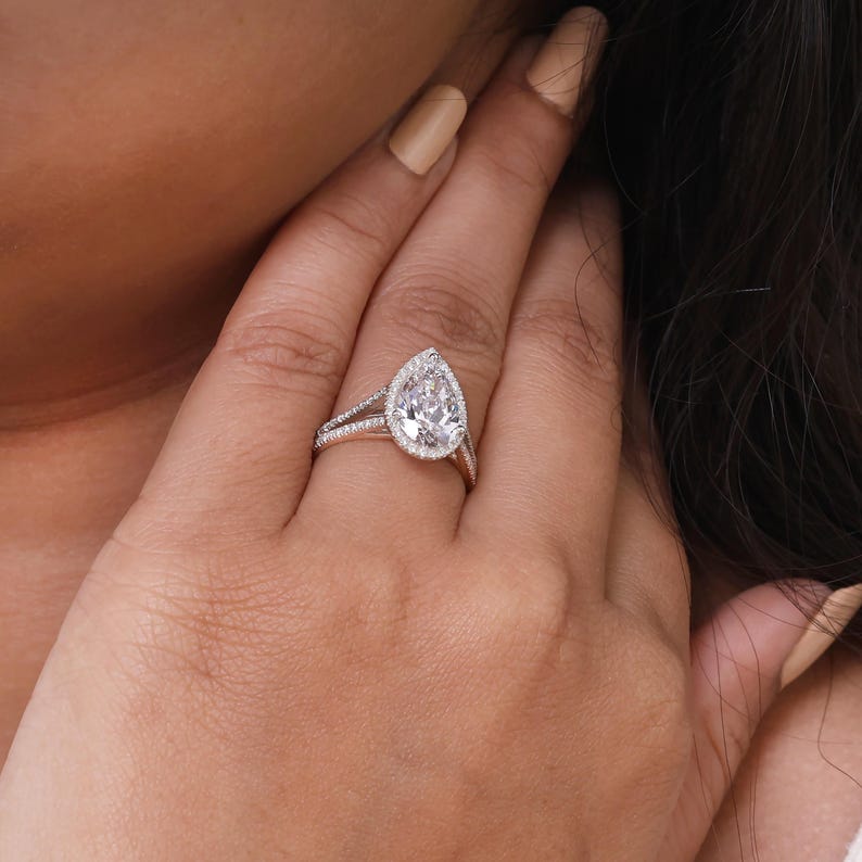 Lab grown pear shaped diamond halo engagement ring with split shank band in white gold