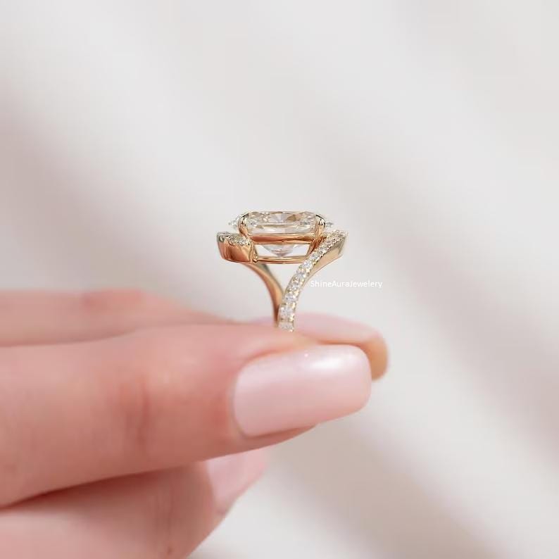 Unique bridal wedding ring with oval moissanite gemstone.