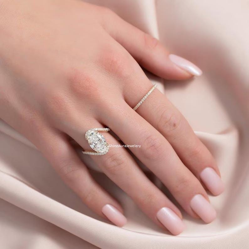 Close-up of oval moissanite stone showing fire and brilliance.