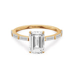 Load image into Gallery viewer, 14k yellow gold ring featuring emerald cut lab grown diamond with baguette side stone.