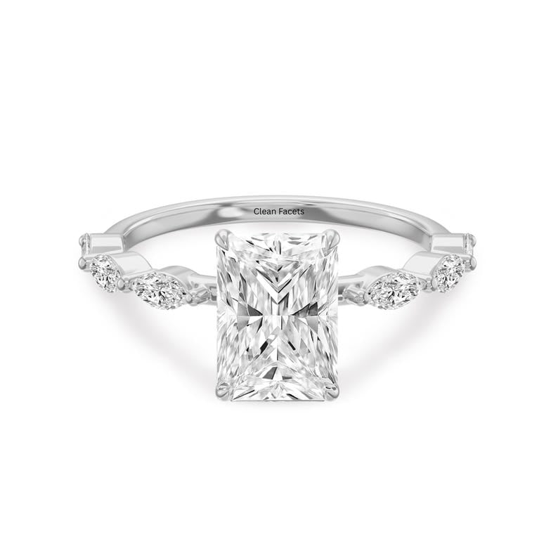 White gold ring featuring radiant cut lab grown diamond with marquise side stone.