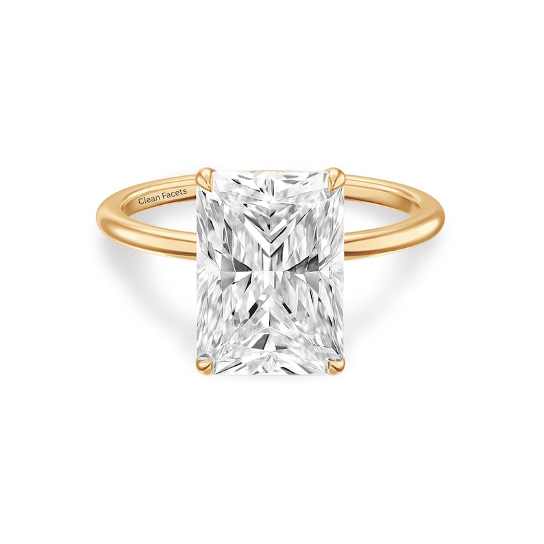 14k yellow gold ring featuring radiant cut lab grown diamond solitaire engagement ring set in 4 claw prongs.
