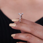 Load image into Gallery viewer, Emerald cut diamond engagement ring with baguette side stone.