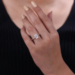 Load image into Gallery viewer, Emerald cut lab grown diamond solitaire ring with baguette side stone.