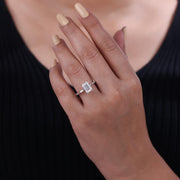 Emerald cut lab grown diamond solitaire ring with baguette side stone.