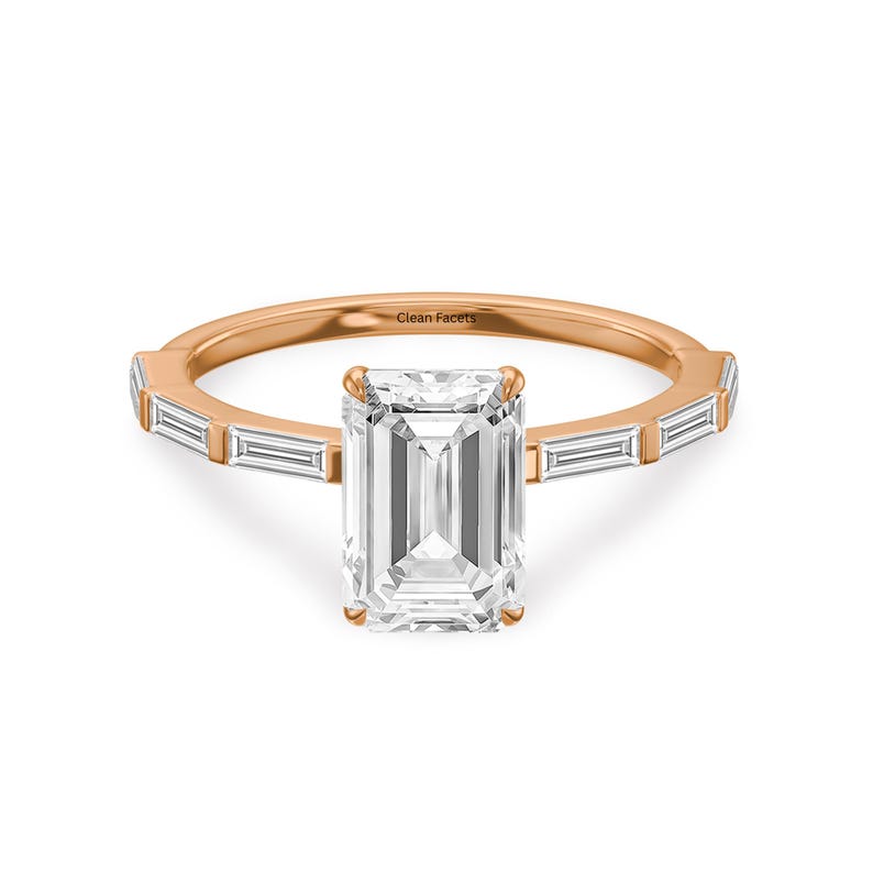 14k rose gold ring featuring lab grown emerald cut diamond with baguette side stone.