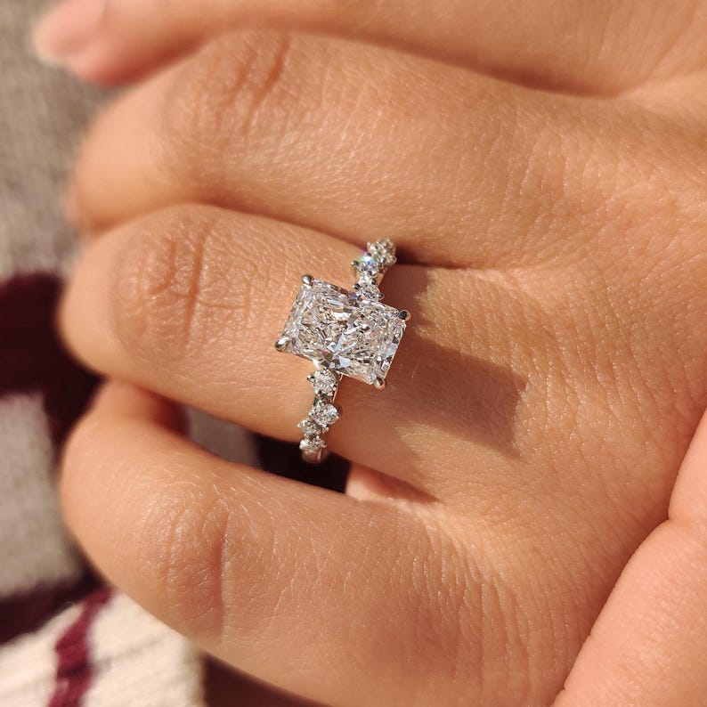 Radiant cut diamond ring designed with hidden halo details.