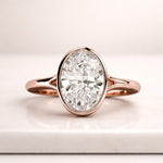 Load image into Gallery viewer, 2.00 ctw 14k Oval Shaped Minimalist Bezel Setting Lab Grown Diamond Engagement Ring – Marcella 2.0 Carat D Color VVS2 Clarity Oval Cut Lab Grown Diamond Solitaire Ring, Bezel Set Engagement Ring, Gold Ring Anniversary Gift for her. 1.59 Ct D, VVS2 Oval Cut IGI Certified Lab Grown Diamond Solitaire Ring, Bezel Set Engagement Ring, Flower Prong White Gold Ring Gift 4 CT Oval Bezel Lab Grown Diamond Ring , Oval Lab Diamond Engagement Ring Bezel Setting Engagement Ring  Vintage Inspired Diamond Ring