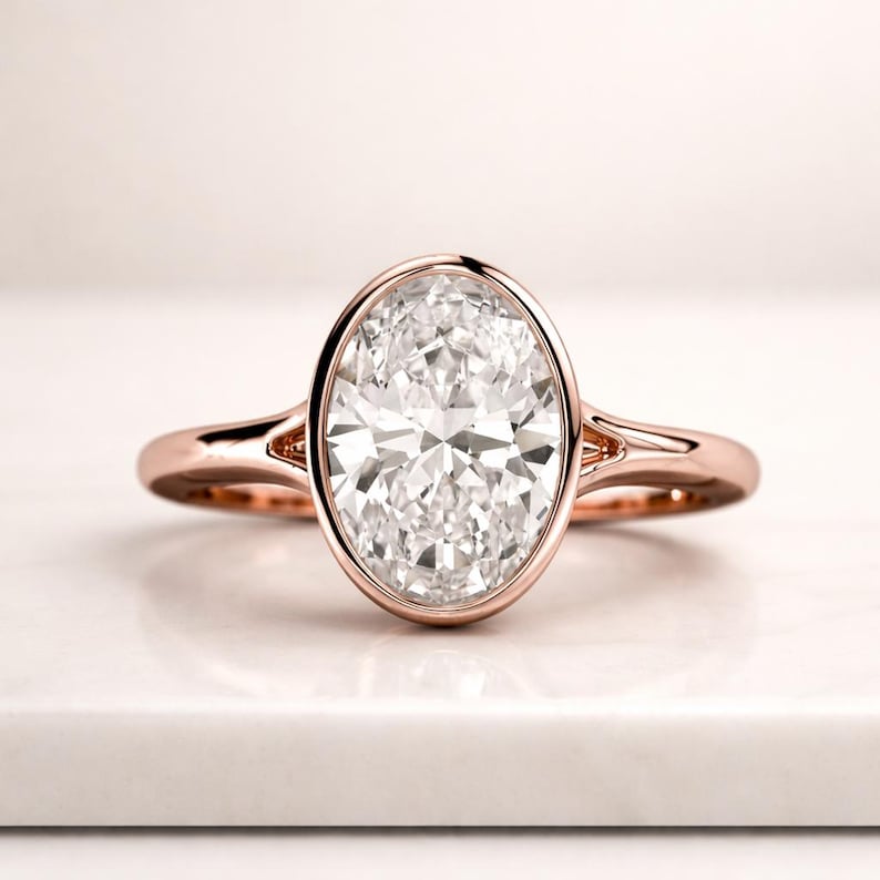 2.00 ctw 14k Oval Shaped Minimalist Bezel Setting Lab Grown Diamond Engagement Ring – Marcella 2.0 Carat D Color VVS2 Clarity Oval Cut Lab Grown Diamond Solitaire Ring, Bezel Set Engagement Ring, Gold Ring Anniversary Gift for her. 1.59 Ct D, VVS2 Oval Cut IGI Certified Lab Grown Diamond Solitaire Ring, Bezel Set Engagement Ring, Flower Prong White Gold Ring Gift 4 CT Oval Bezel Lab Grown Diamond Ring , Oval Lab Diamond Engagement Ring Bezel Setting Engagement Ring  Vintage Inspired Diamond Ring