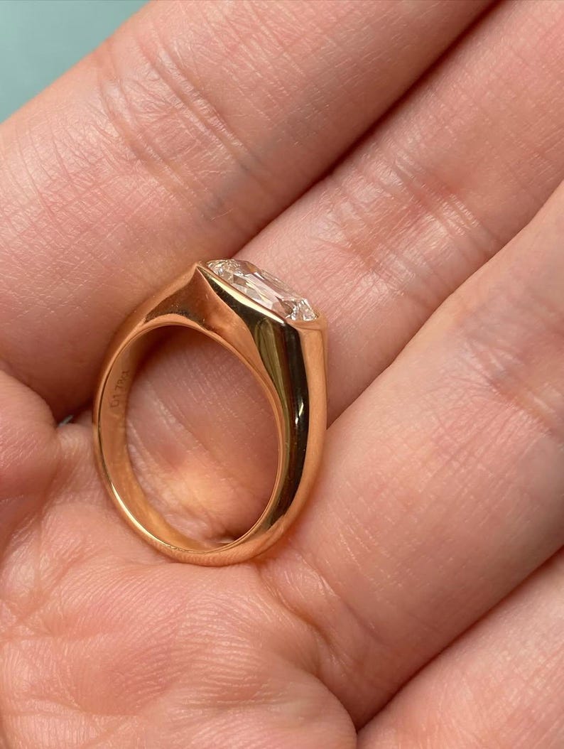 cushion lab grown diamond bezel set engagement ring in yellow gold
