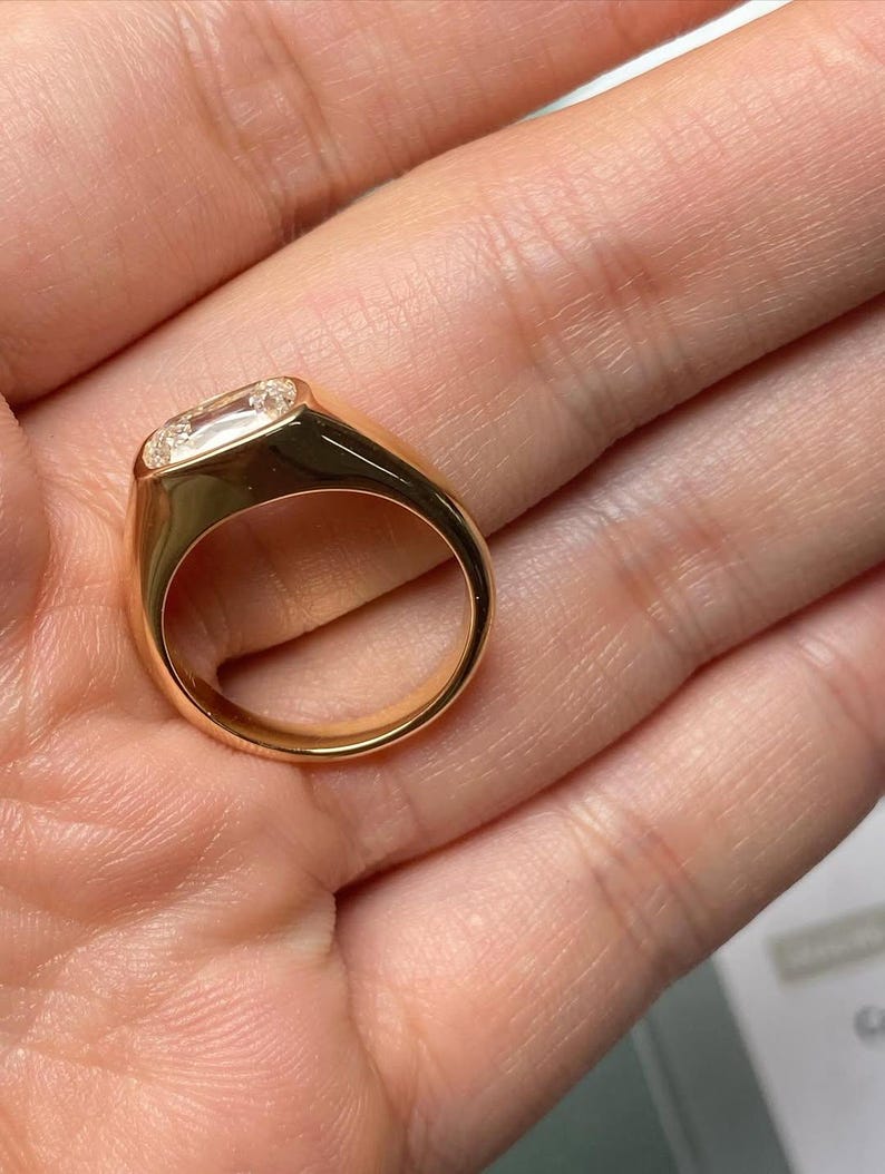 cushion lab grown diamond bezel set engagement ring in yellow gold