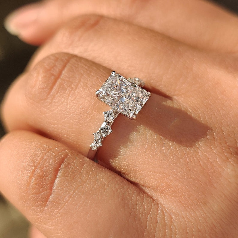 Cluster setting radiant cut diamond ring with extra sparkle.