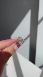 Load and play video in Gallery viewer, 3.00 Ct Lab-Grown Diamond Oval Engagement Ring: Gold Bezel Set with Marquise Accents